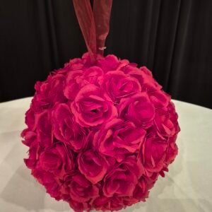 Red ball kissing ball used as decorative event décor.