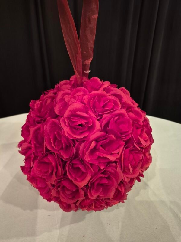 Red ball kissing ball used as decorative event décor.