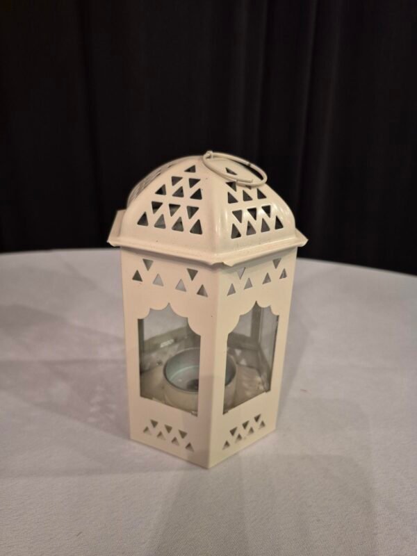 Decorative lantern light with tea light inside for events.