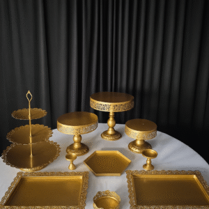 Gold metal 10 piece dessert table stands and trays for event display.