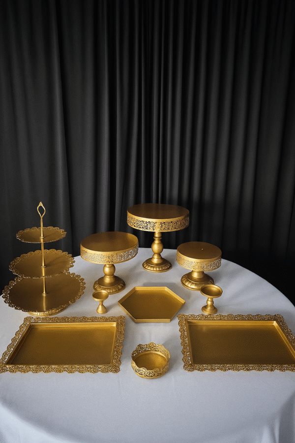 Gold metal 10 piece dessert table stands and trays for event display.