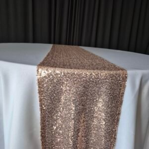 Rose gold sequin runners displayed on an event table.
