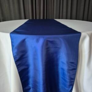Royal blue table runners on an event table.