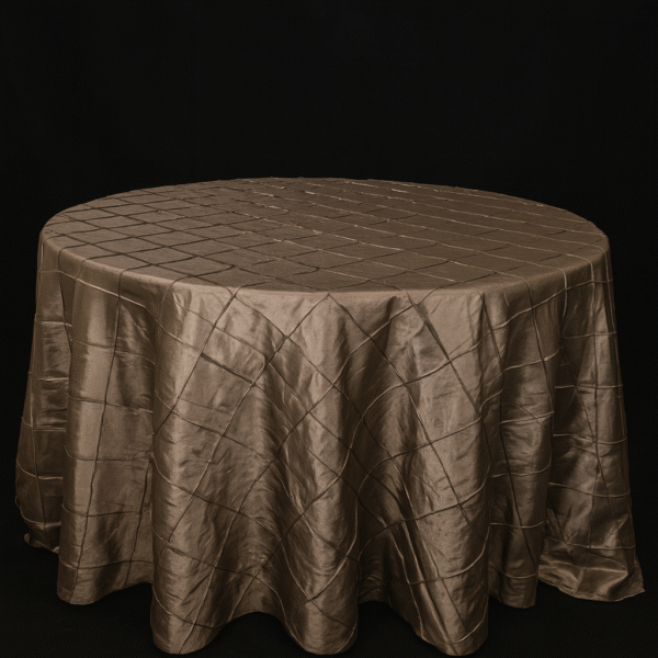 Copper pintuck round tablecloth on an event table.