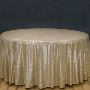 Champagne sequin round tablecloth on an event table.