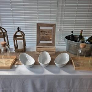 Rustic bar table with Elegance Mimosa setup for events and parties.