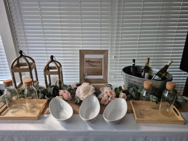 Rustic bar table with Rustic Elegance and Floral Flair Mimosa Bar Table setup.