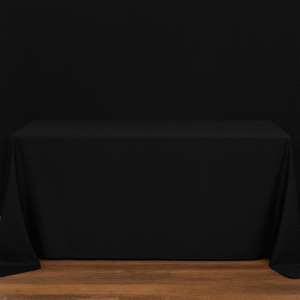 Black rectangle tablecloth covering an event table.