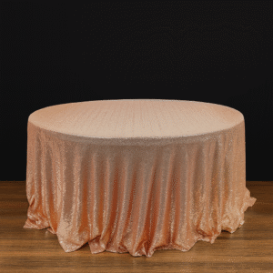 Rose gold round tablecloth on an event table.