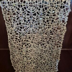 Silver sequin lace runners on an event table.