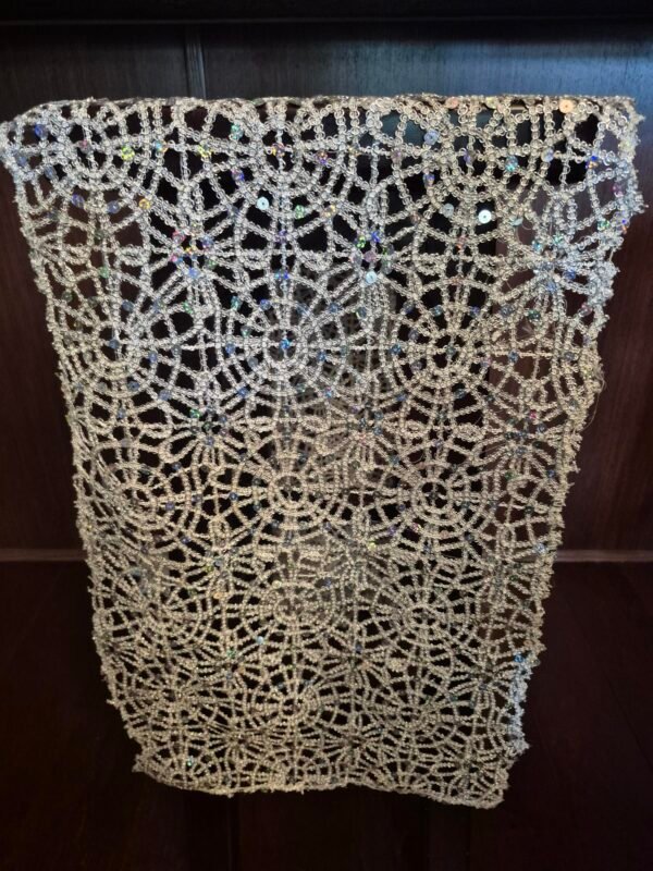 Silver sequin lace runners on an event table.