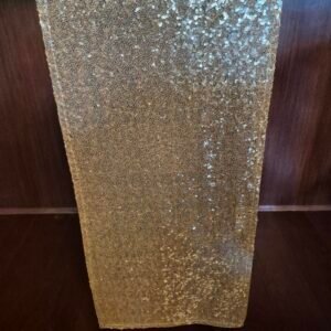 Champagne sequin runners displayed for event or party.
